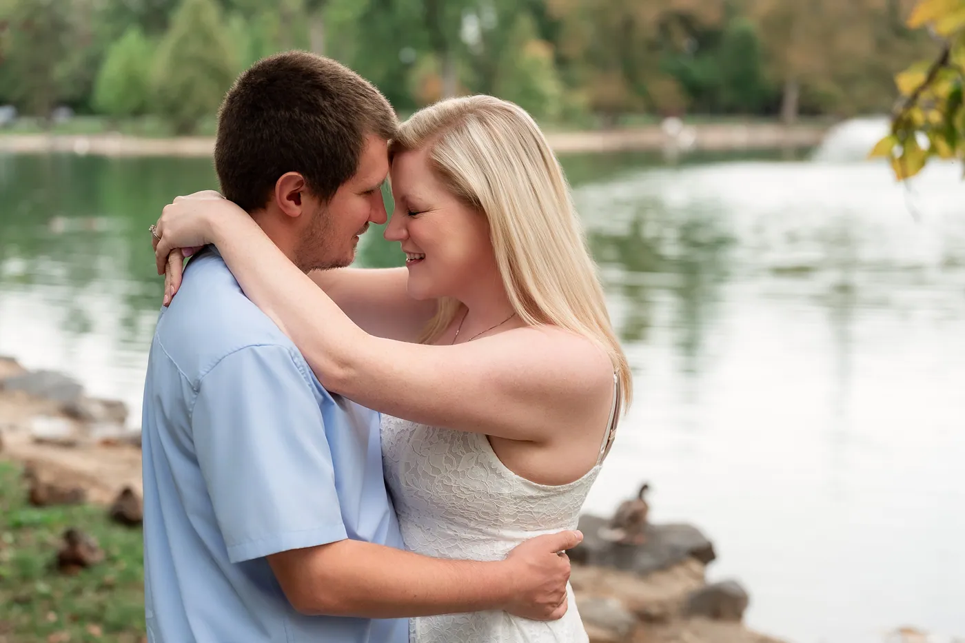 Kaitlyn and Nicholas embracing by the water