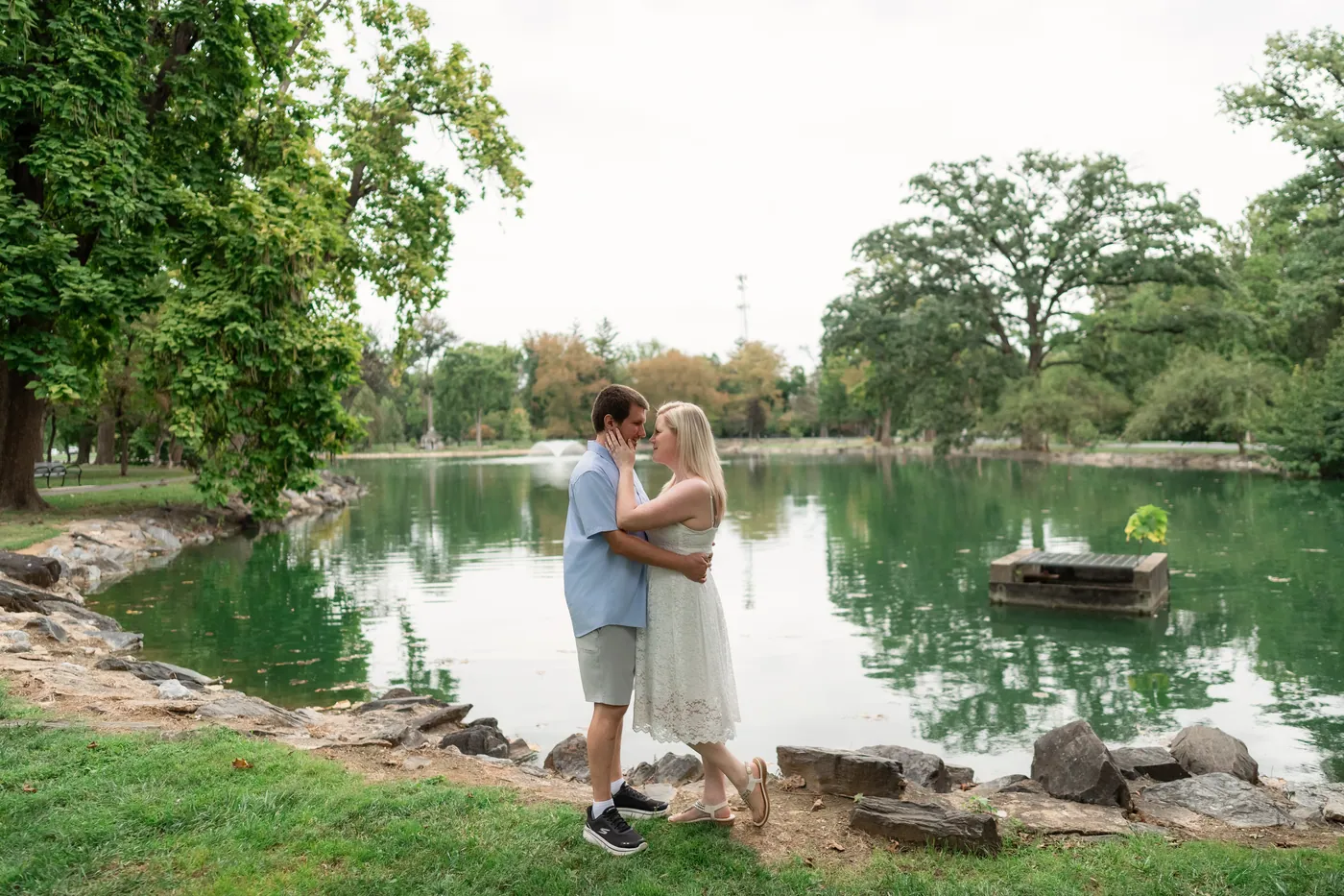 Kaitlyn and Nicholas framed by the lakeside landscape
