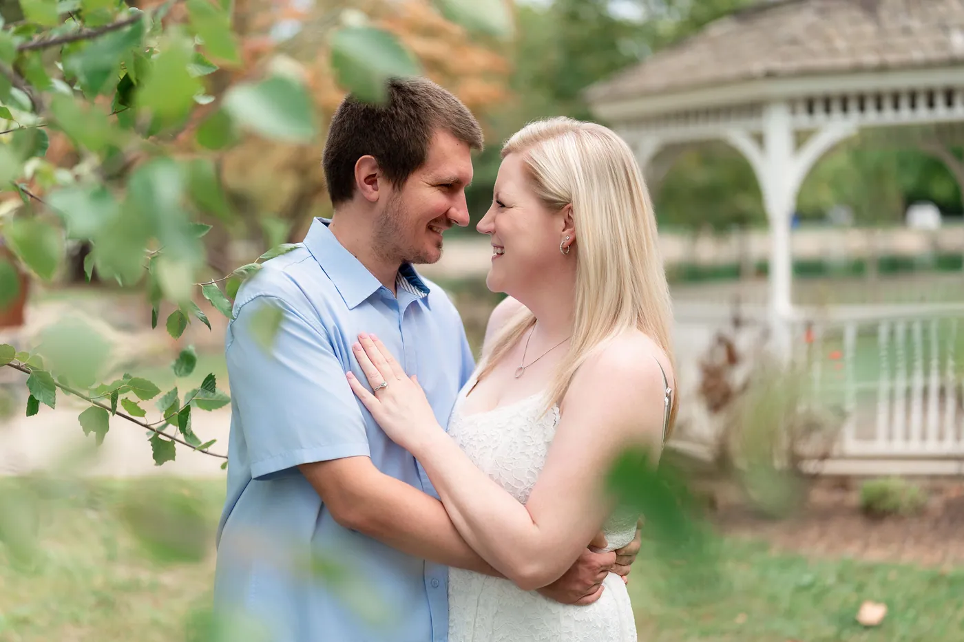 Kaitlyn and Nicholas sharing a kiss among the flowers