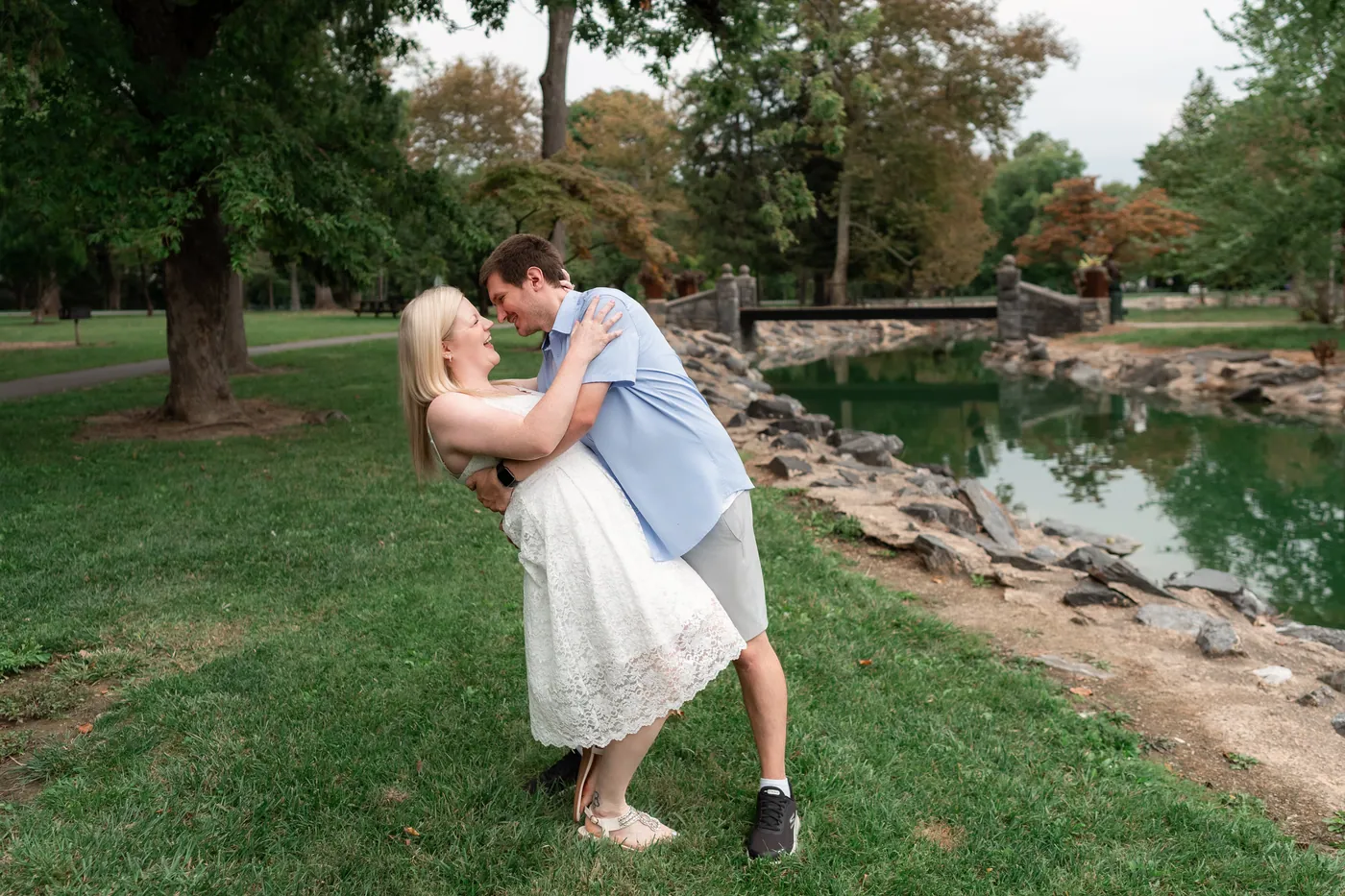 Kaitlyn and Nicholas laughing together beside the water