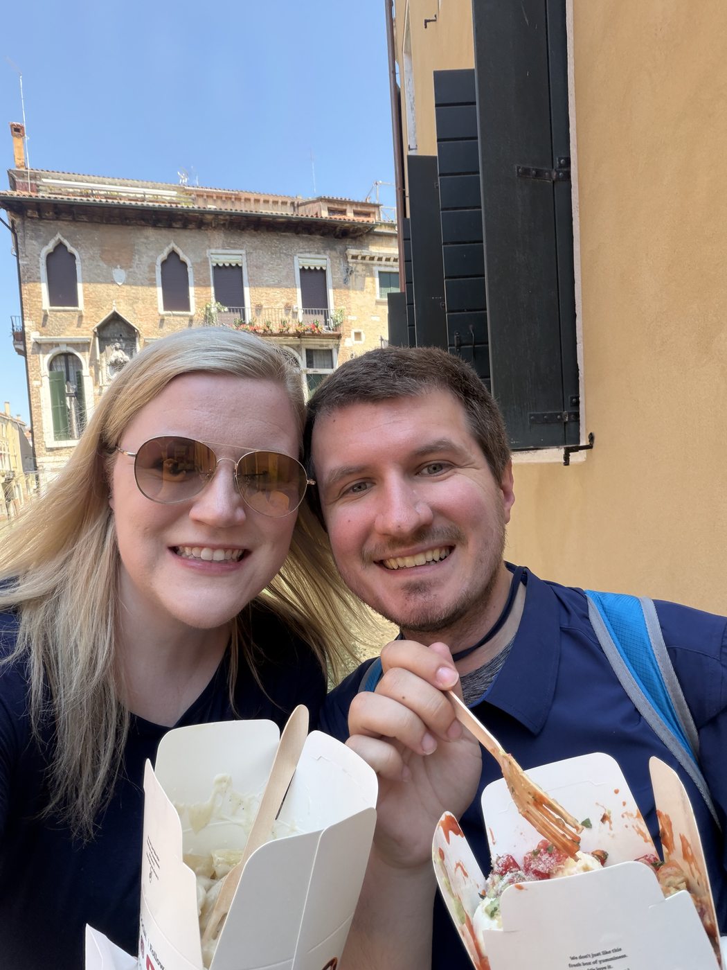 Kaitlyn and Nicholas sharing pasta in Venice